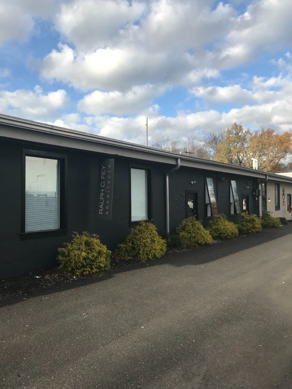 one story commercial exterior dark gray windows