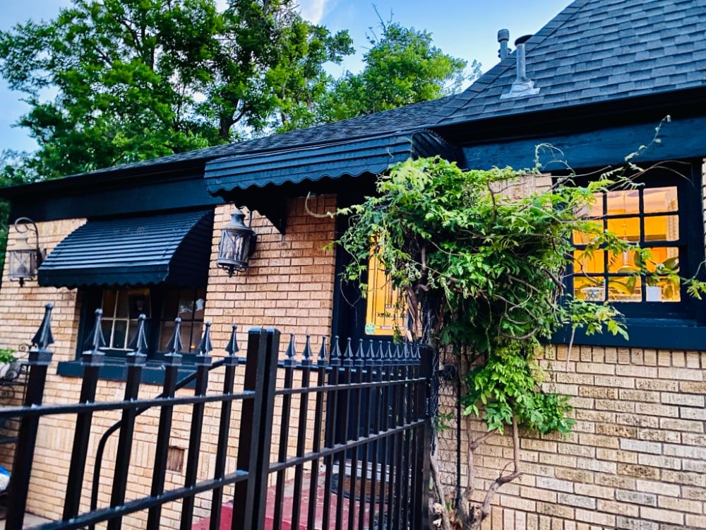 Exterior house painting with carpentry repairs. Color: Sherwin Williams - Tricorn Black