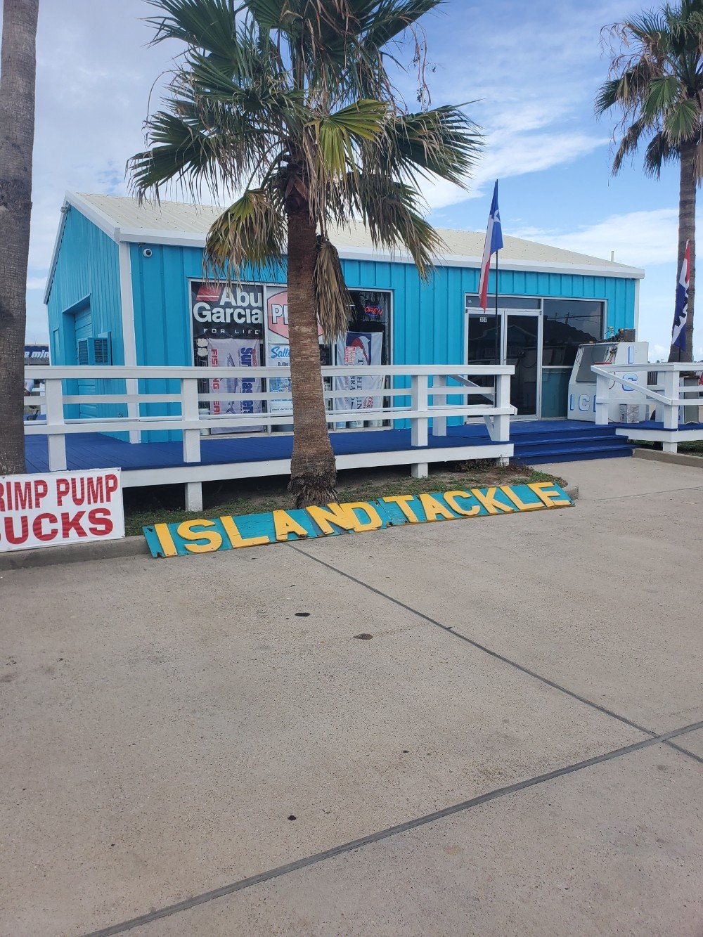 Island Tackle in Port Aransas done in Sherwin Williams Calypso with Extra White Trim. Deck was done in Sherwin Williams Super Deck Dignity Blue with Extra White handrails