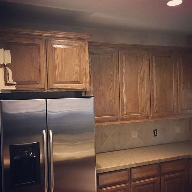Light grey brown cabinetry in kitchen