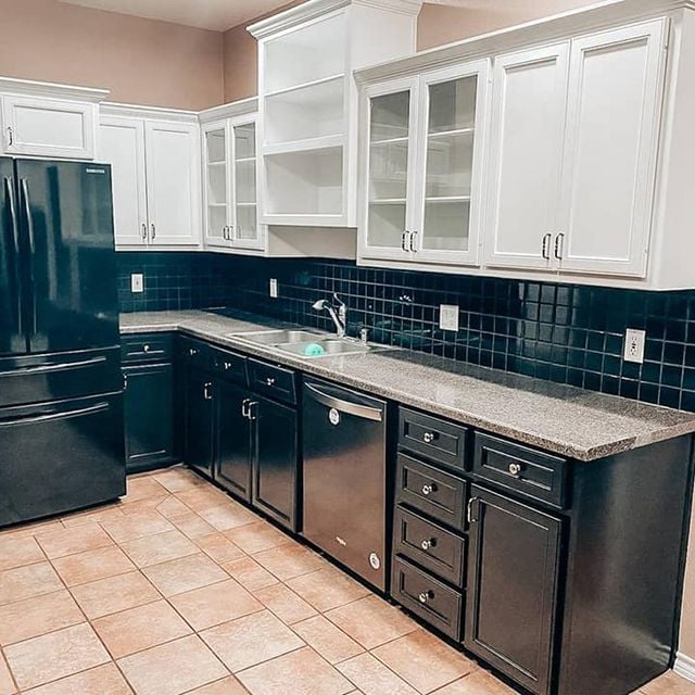 blue and white kitchen cabinets with granite counter