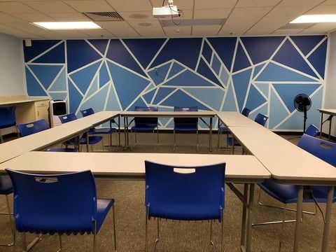 blue office room with tables and chairs