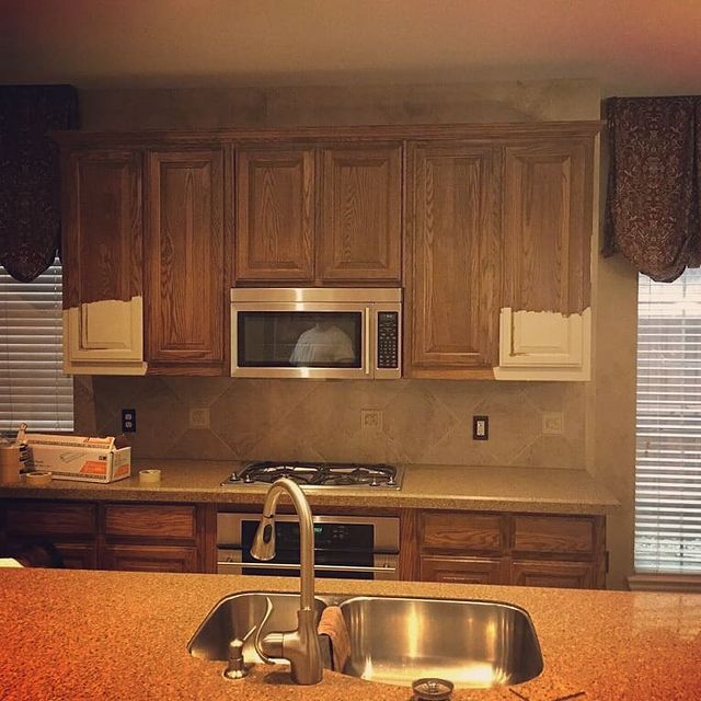 brown cabinet kitchen with sink