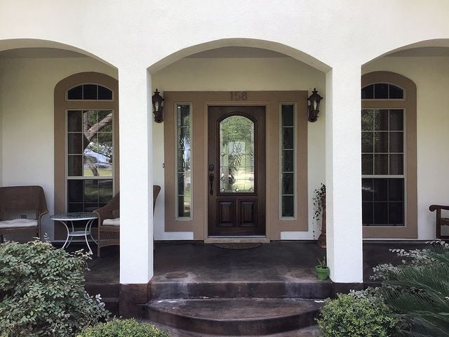 white house with brown door and light brown accents