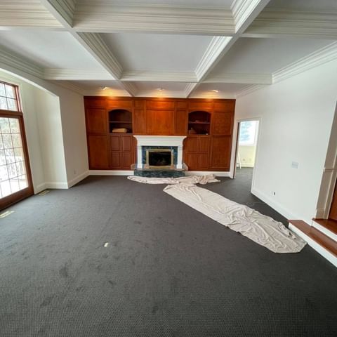 white room with a fireplace