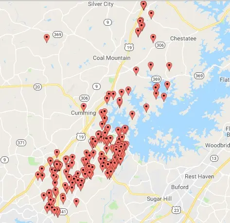 Map with multiple red markers on it.