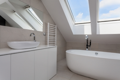 Small Bathroom with White Walls and Features.