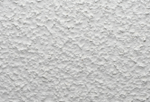 Close-up photo of a popcorn ceiling.