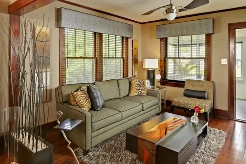 Living room with wooden accents and pale yellow walls.