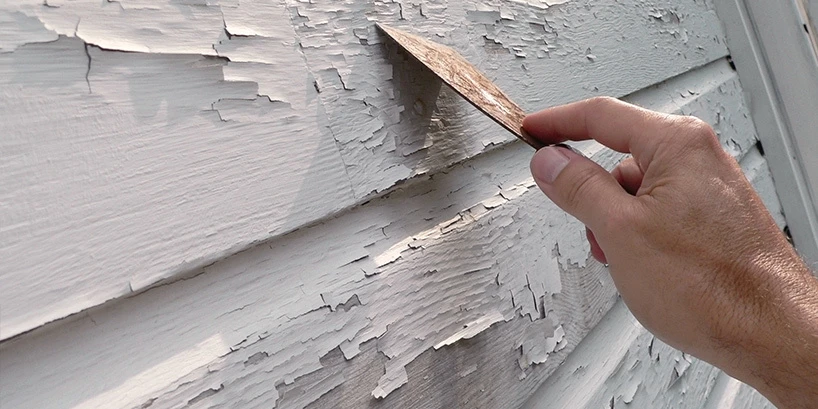 Person removing white paint.