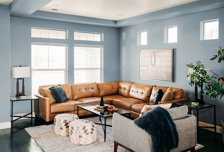 Living room with bluish-gray walls painted by Five Star Painting 