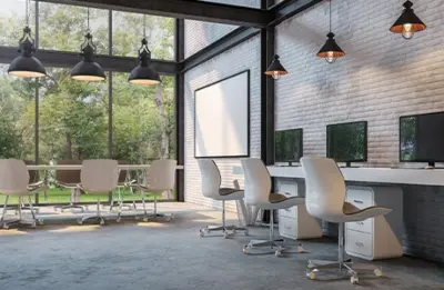 A large interior office space with a conference table, chairs, filing cabinets and computers painted by Five Star Painting of Frisco.